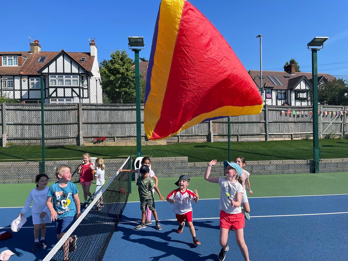 Children playing games at a Metro Tennis summer camp