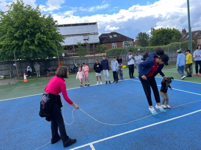 Players enjoying an inclusive Metro Tennis activity on court
